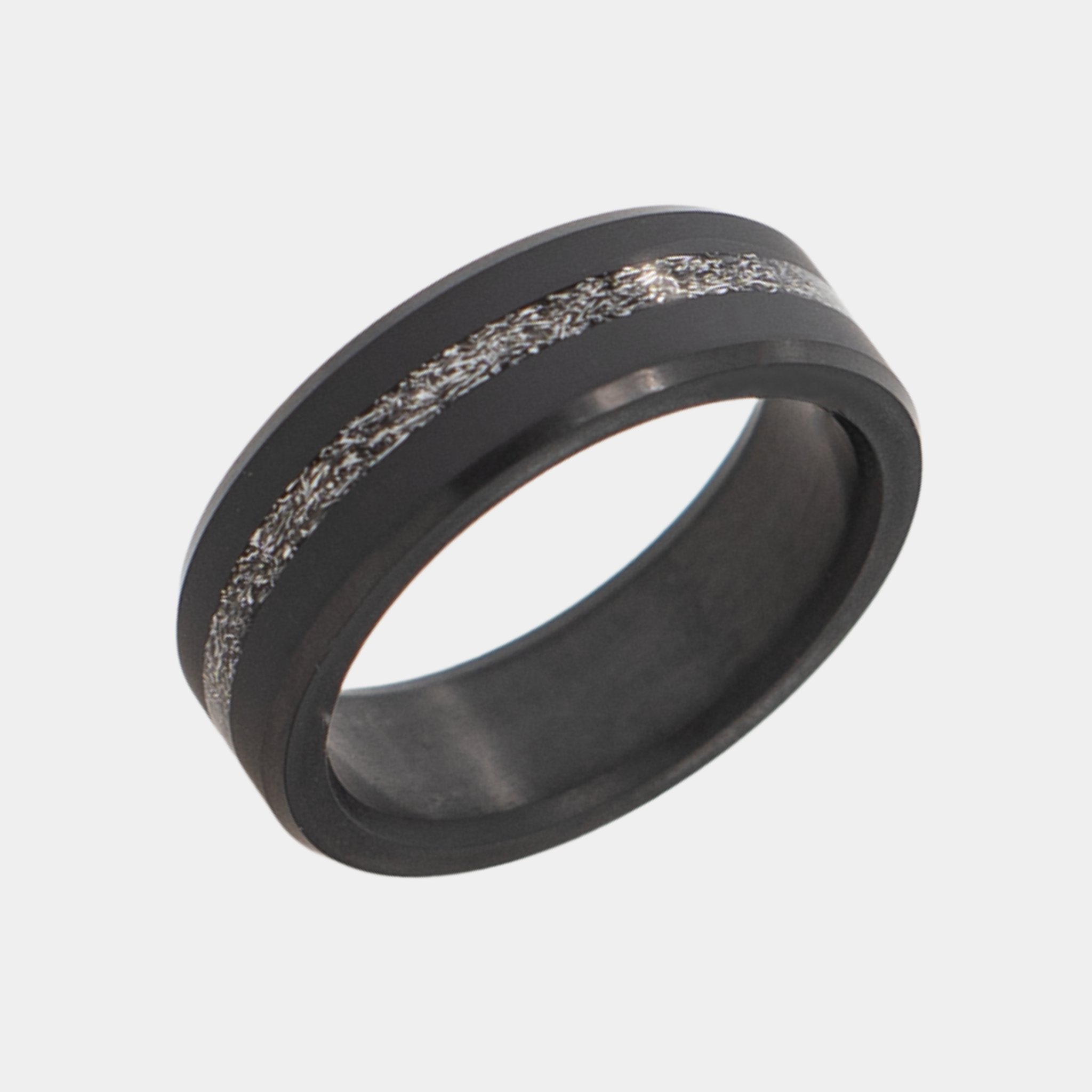 Solid Black Diamond ring with a meteorite band on a light gray background