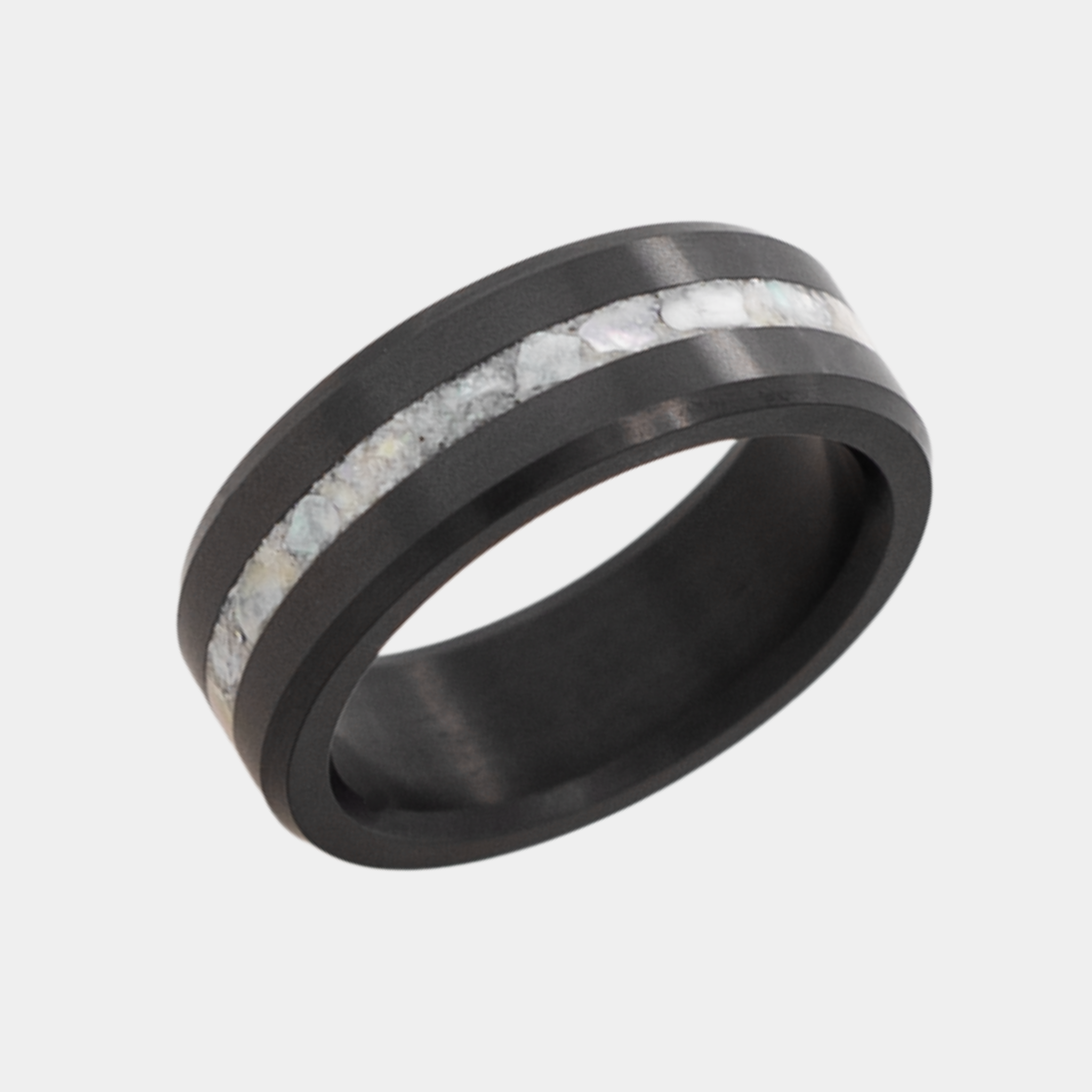 Solid Black Diamond ring with a crushed mother of pearl inlay on a light gray background
