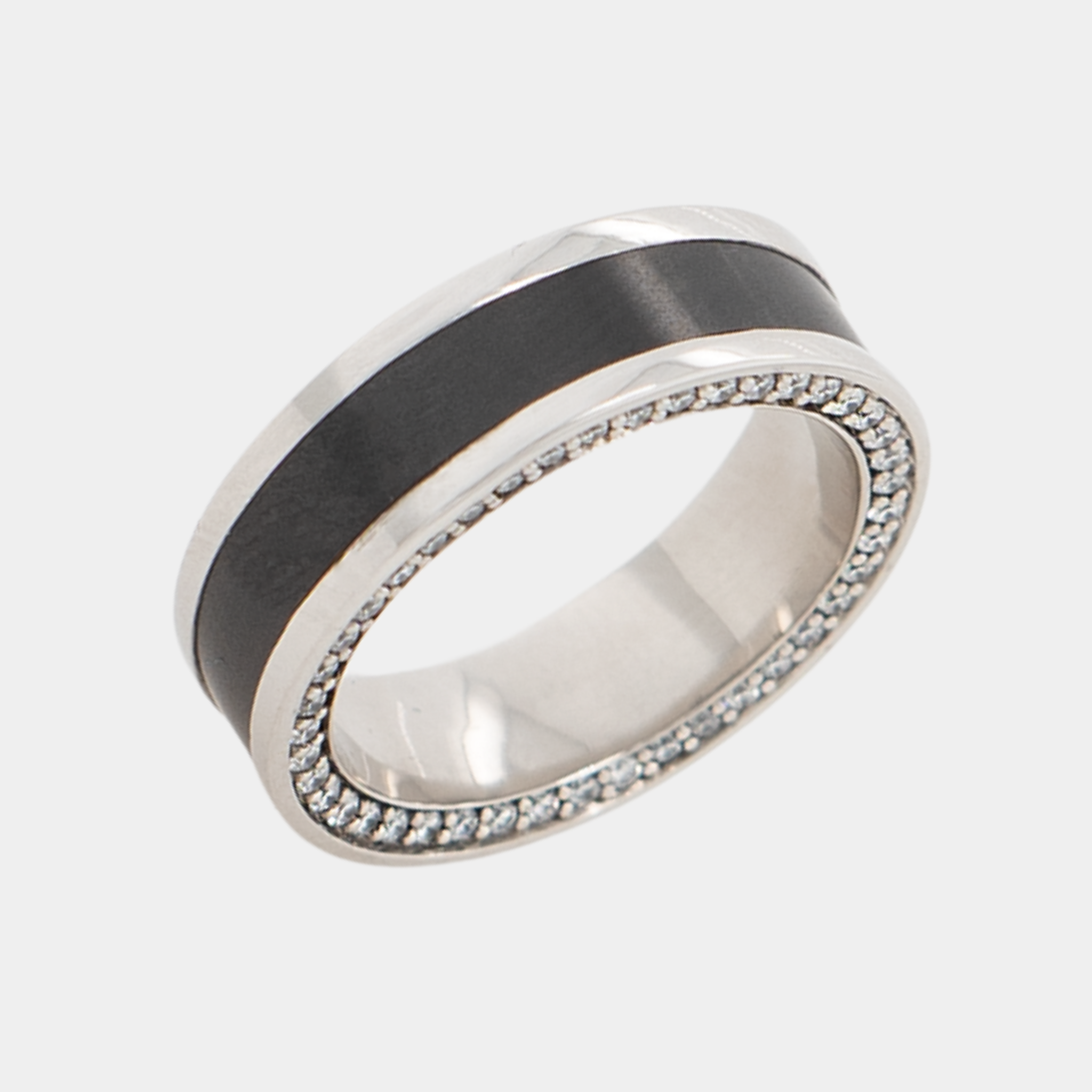 ZEUS ring – 7mm black diamond men’s ring with a platinum band, black diamond inlay, and white diamond insets. Angled view highlighting the platinum band and contrast between the black diamond inlay and white diamond insets.