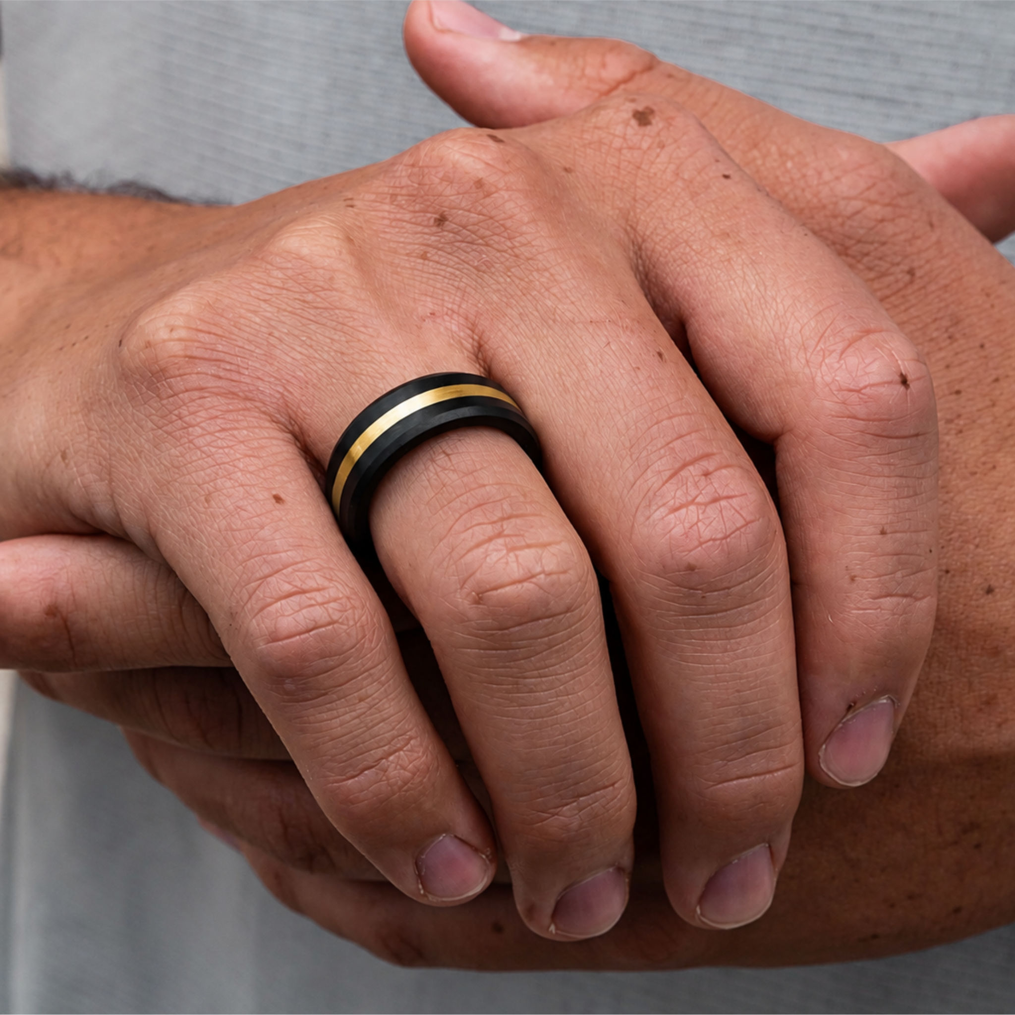 ARES 8mm solid black diamond ring with 24K yellow gold inlay worn on hand
