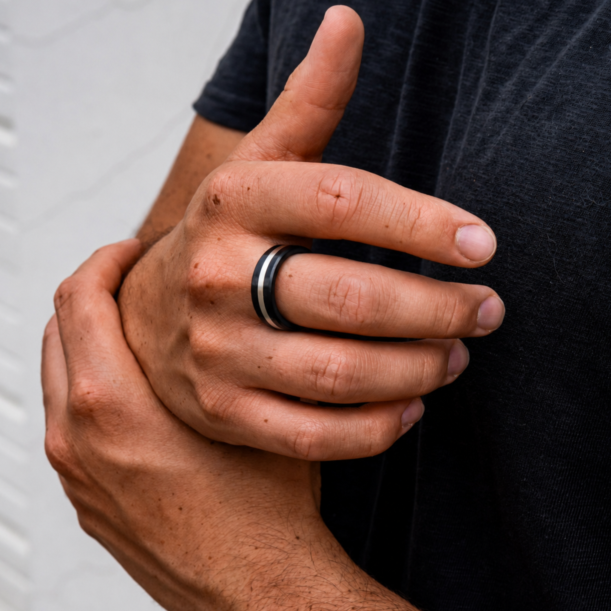 ARES 8mm silver inlay wedding band in solid black diamond worn on hand
