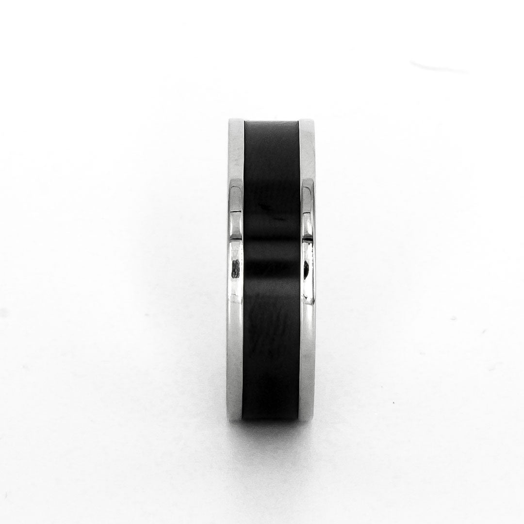Elysium Zeus solid black diamond inlay ring with white diamond insets & with a white background & straight on view | Men’s Black Diamond Platinum Rings