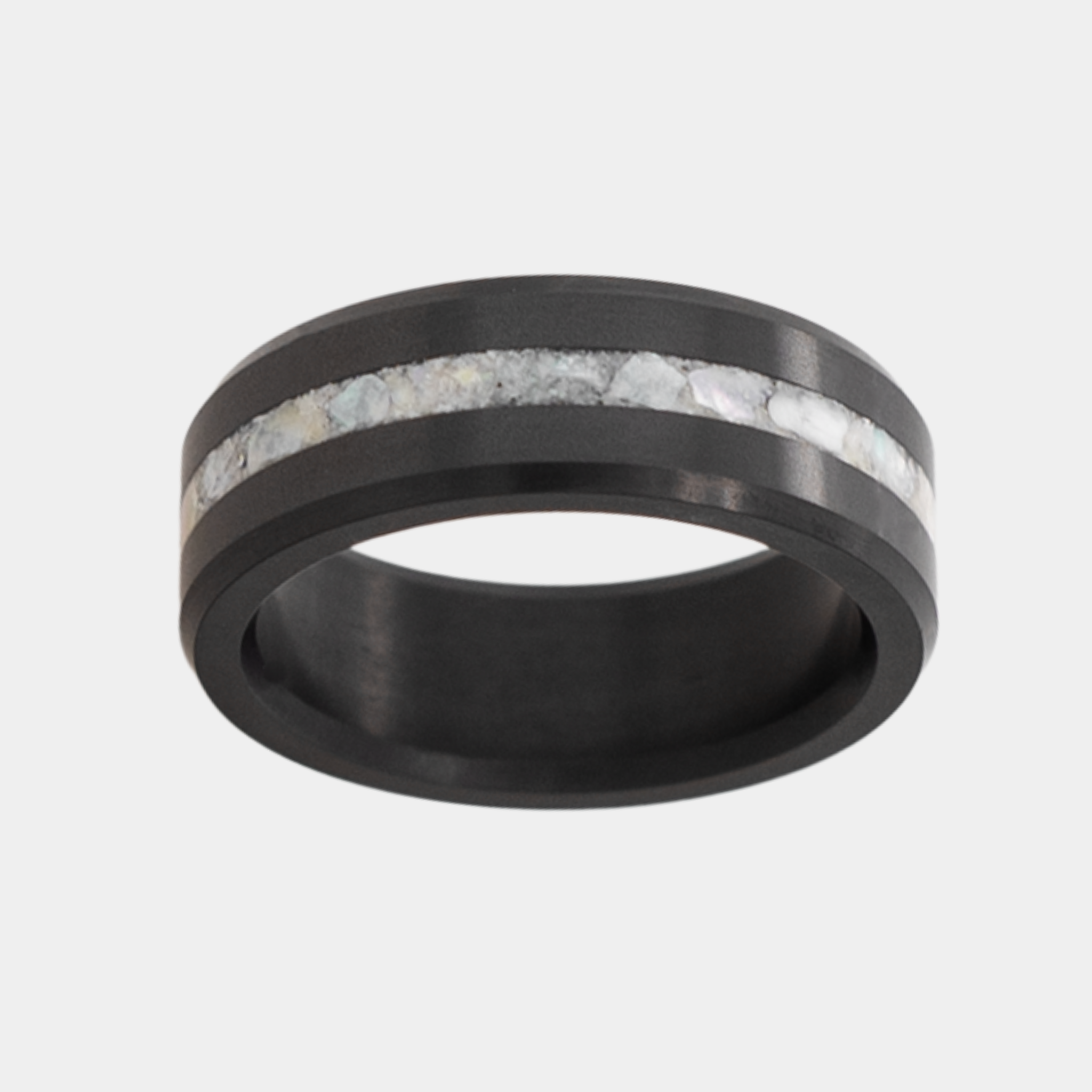 Solid Black Diamond ring with a crushed mother of pearl inlay on a light gray background