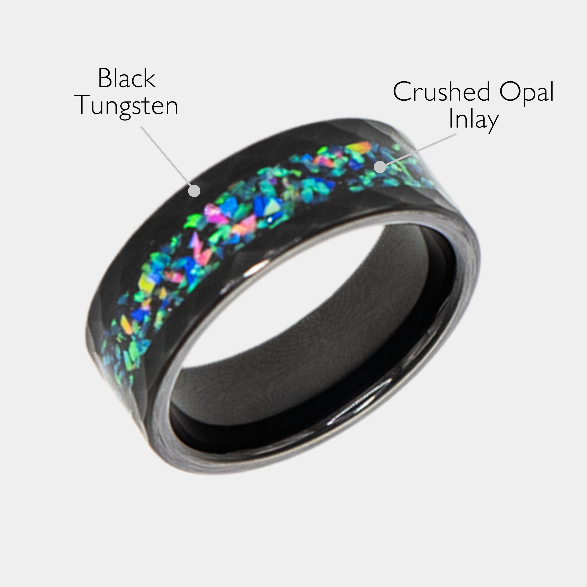 Aeolus ring – Hammered Black Tungsten, Crushed Opal Inlay from the Hustler Collection. Angled view with product name overlay.