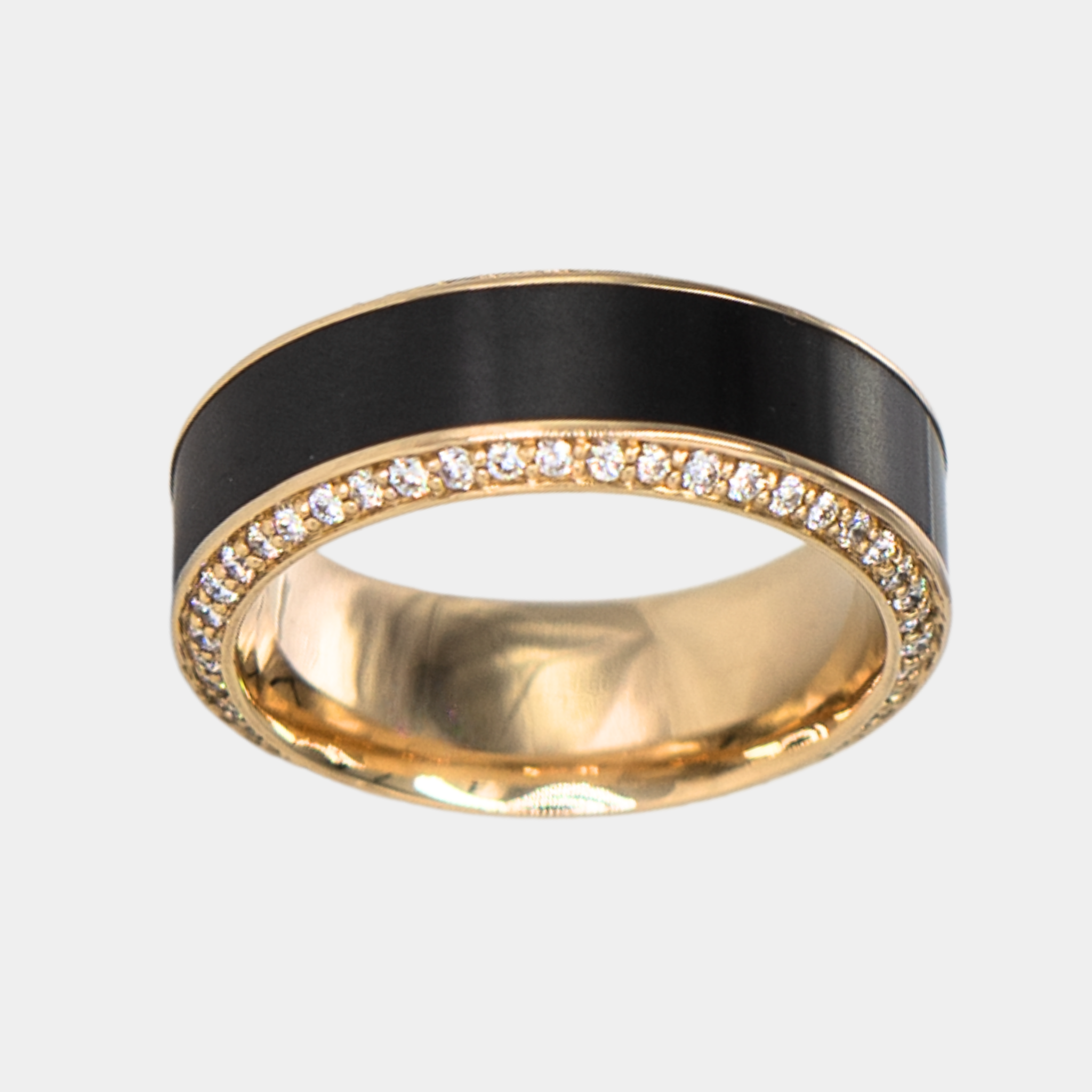 HELIOS ring – 8mm black diamond men’s ring with a yellow gold band, black diamond inlay, and white diamond insets. Top-down view showing the symmetry of the black diamond inlay and white diamond insets.