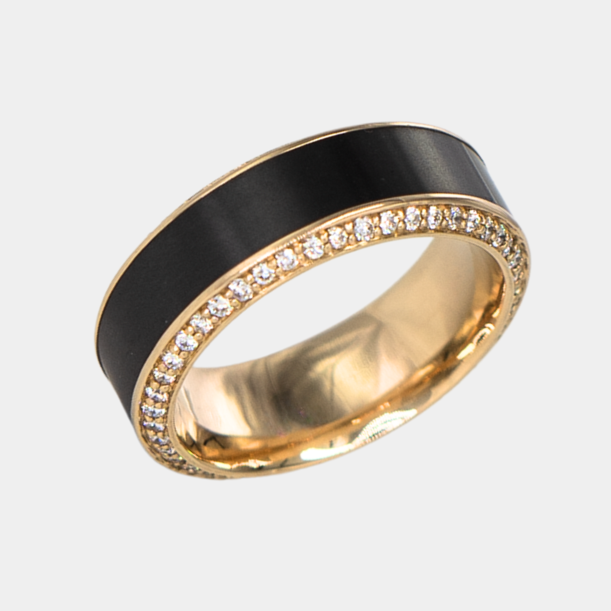 HELIOS ring – 8mm black diamond men’s ring with a yellow gold band, black diamond inlay, and white diamond insets. Angled view highlighting the yellow gold band and contrast between the black diamond inlay and white diamond insets.