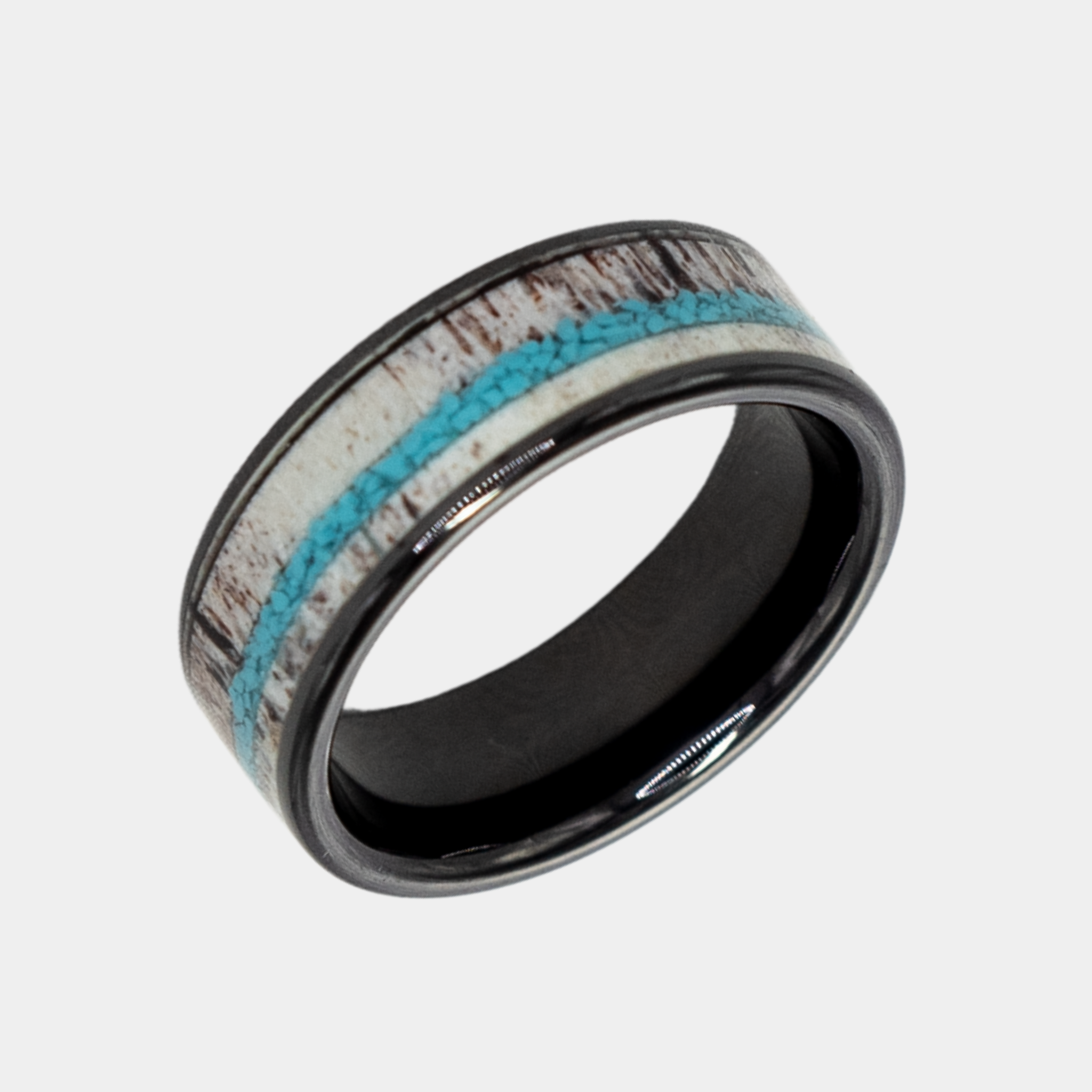 Hermes ring – Polished Black Ceramic with Turquoise and Deer Antler Inlays from the Hustler Collection. Angled view highlighting shape and finish.