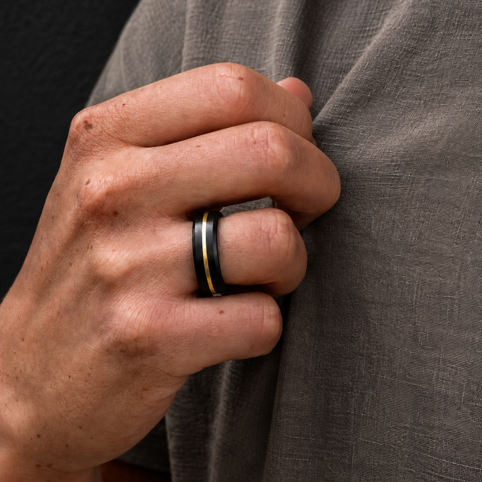 ARES 7mm solid black diamond ring with 1mm 24K yellow gold inlay worn on hand