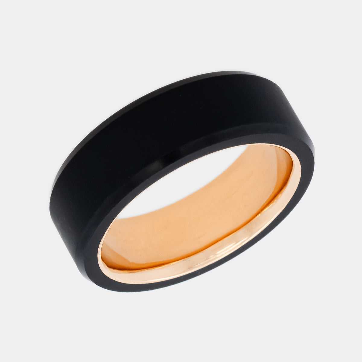 Solid Black Diamond Ring with a 14k Rose Gold Sleeve on White Background | Elysium Black Diamond Ring - Ares 8mm | Rose Gold and Black Diamond Ring | Products | Image 1